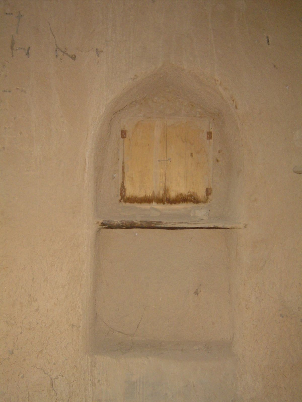 Typical shelving built into the wall.