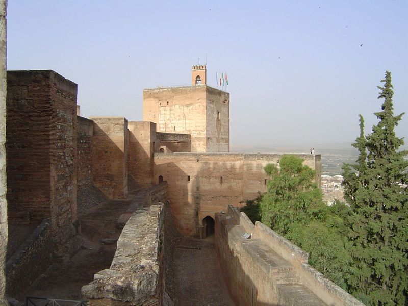 The Alhambra lies atop a narrow ridge and consists of three parts: a small town that catered to royal needs and which is now obliterated; th