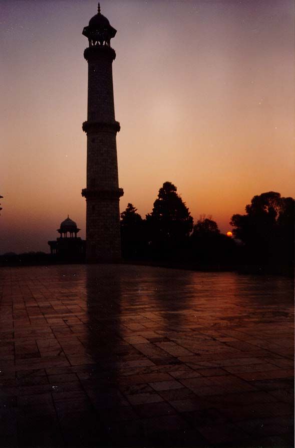 The southeast minaret at sunrise. The structure is of white marble whose color changes profoundly in different lights. Shah Jahan had it qua