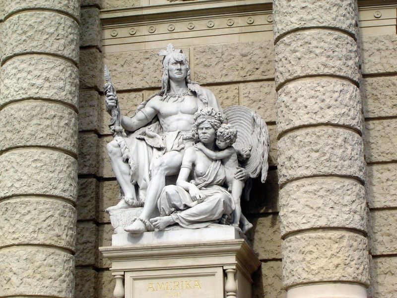 A detail from the facade of the Natural History Museum. She wants to know why the guy got the chair.