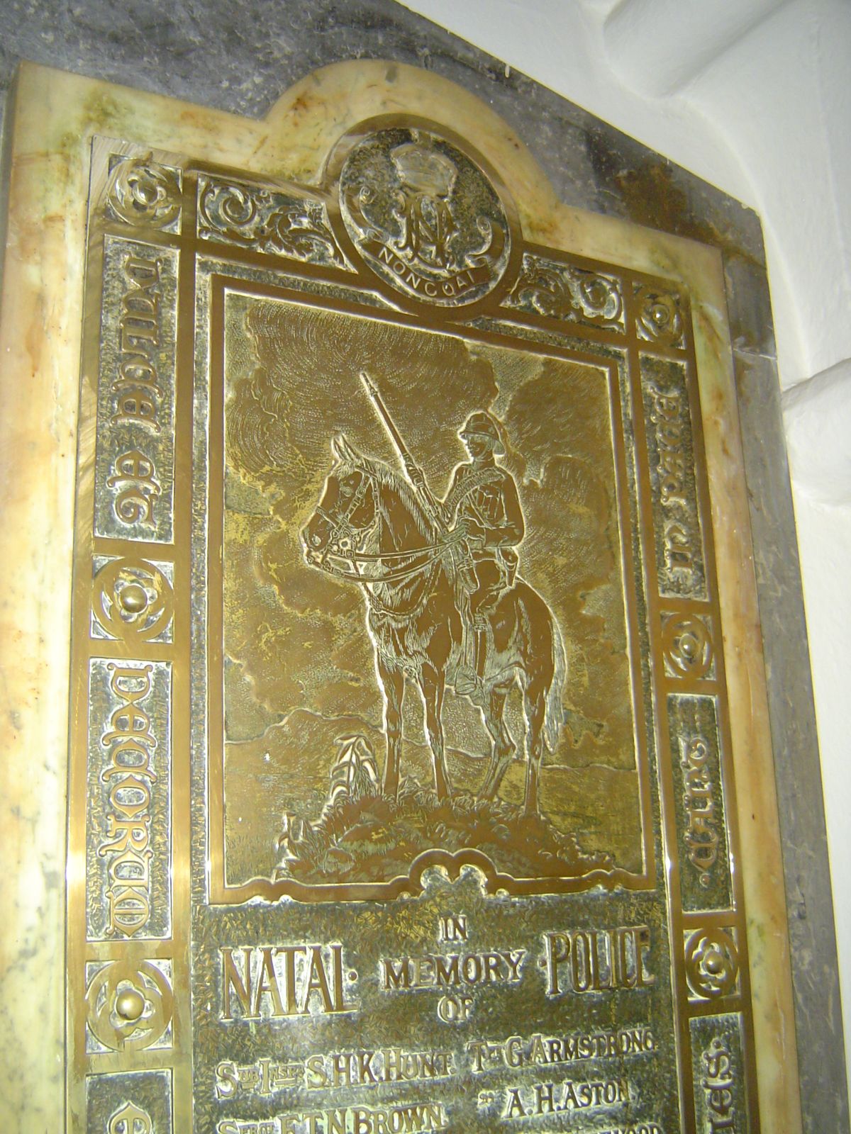 Up in the choir loft, so dark that the walls are almost invisible without a camera flash, there are a few plaques, including some elegant on