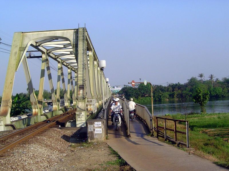 Upstream, there's a railroad and cycle bridge. Not very pedestrian friendly.