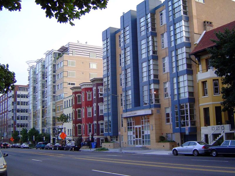 New apartments cozy up to surviving townhouses.