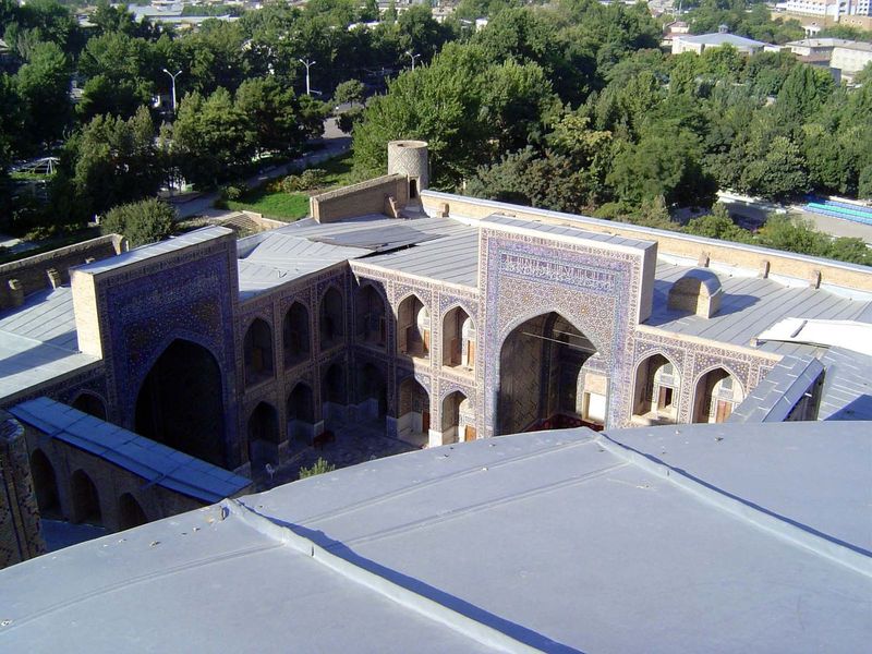 View over sheetmetal roofs and into the madrasa courtyard.