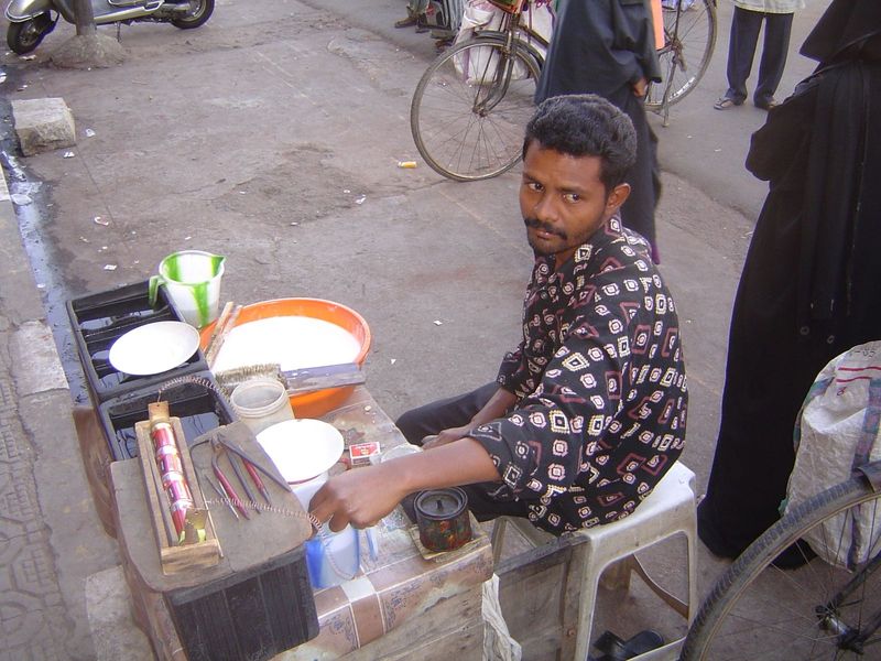 Curbside tradesman. Figure out what he does?