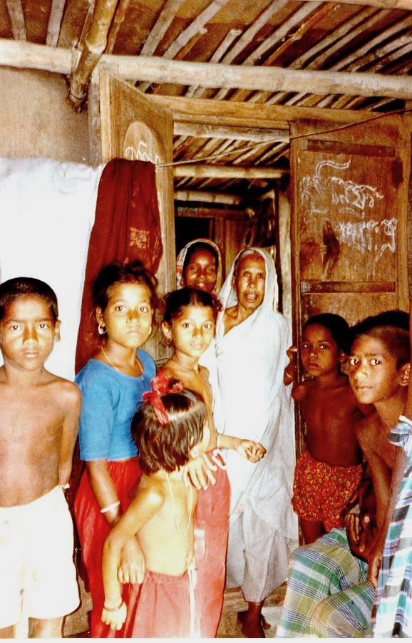A widowed mother comes to offer water and puffed rice.