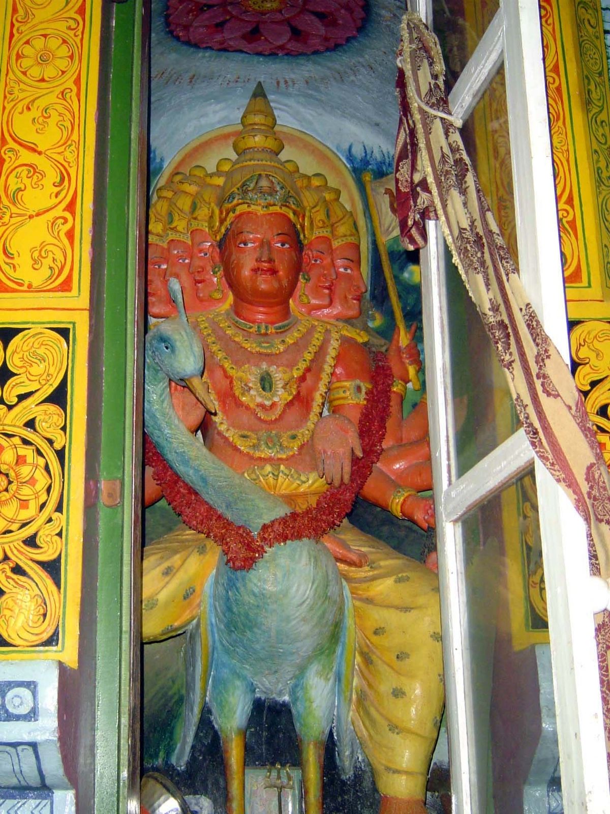 Also on the east face, doors open to reveal Kataragama, or Skandu, the god of war.