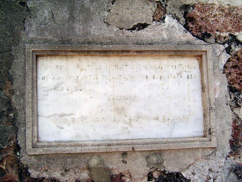 Busy destroying the wall, the British caught themselves just in time, saved this gate, and posted this plaque: "The only remaining part of t