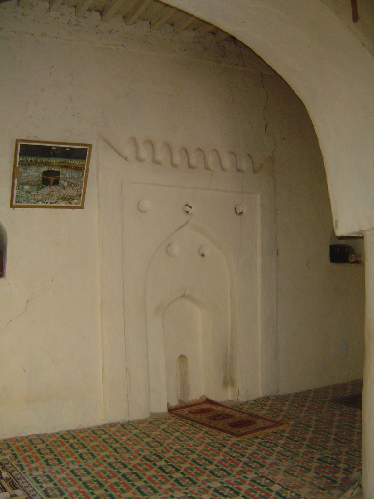 Mosque with mihrab and picture of the ka'bah in Mecca.