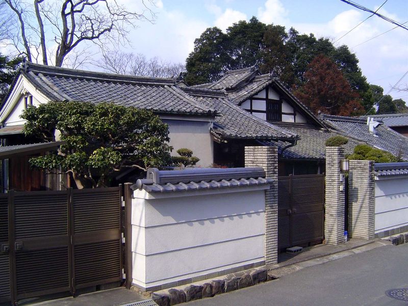 Same street, this time emphasizing the palette of roofing materials and styles drawing on monumental precedents, which themselves originally