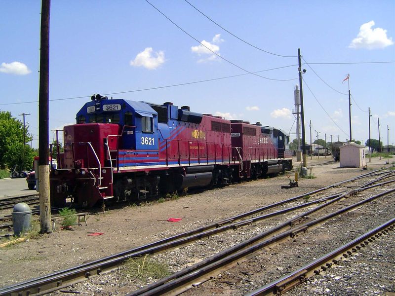 The locos read Kansas and Oklahoma—odd name for a railroad that operates from Wichita west to the Colorado Line. It's owner, WATCO, also ope