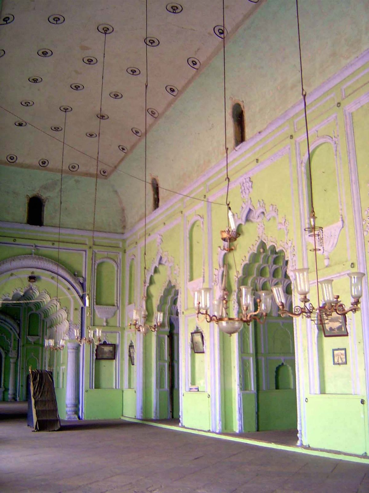 This is not a palace, not a mosque. Nobody ever lived here. Instead it housed and still houses ephemeral taziyas, carried in an annual proce