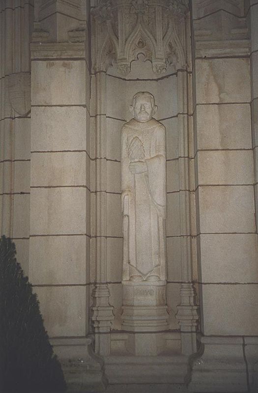 Chartres-style niches were built into the facade, much as they were into the Tudor Gate of Trinity College. They are occupied here by statue