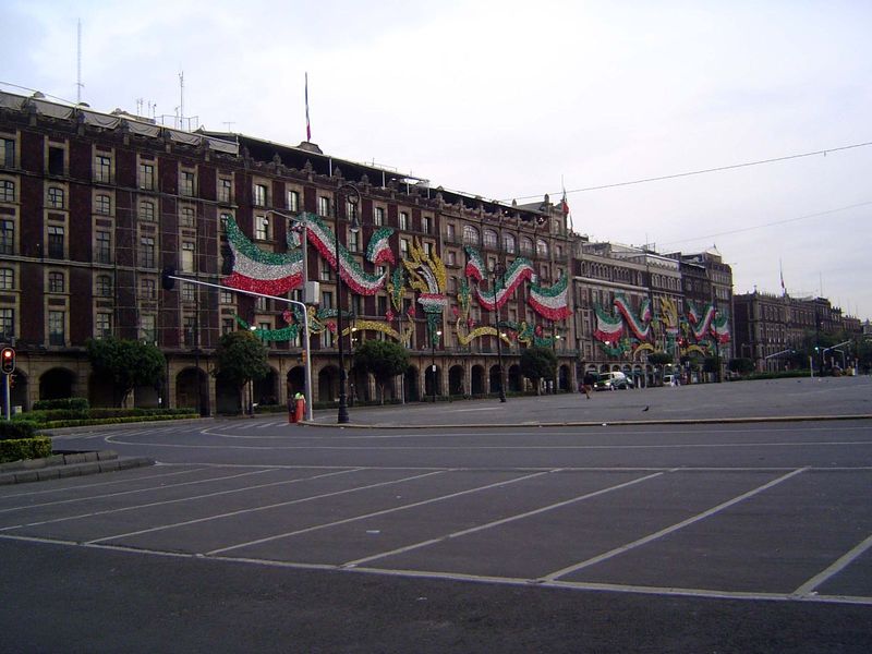 Trees and benches were removed from the Zócalo in the 1960s. The view here, early in the morning before traffic rolls in, shows the west fro