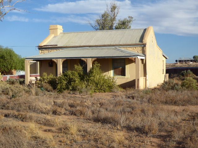 The roof is a modified skillion, with add-ons at the back that continue the sloping line.