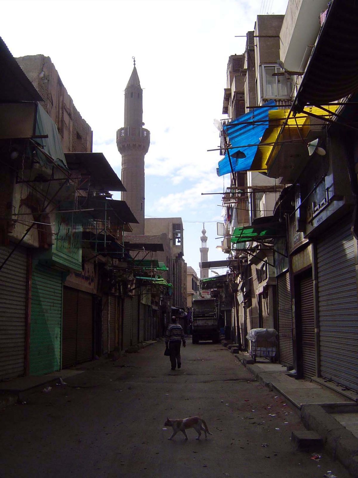 Early in the morning, the street is quiet. The minaret ahead belongs to the Mosque of al-Fakahani, "the fruitseller."
