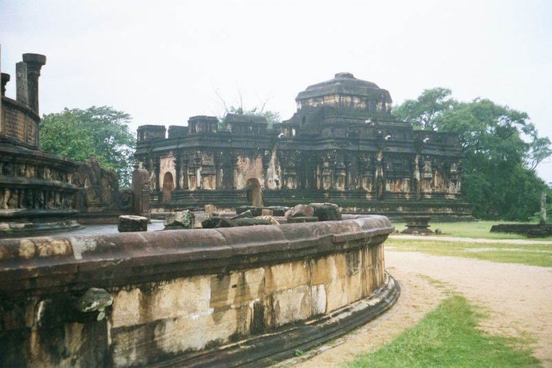 Looking southwest from that entrance: in the distance is one of Polonnaruwa's three pilimages, "image houses" enclosing giant statues of the