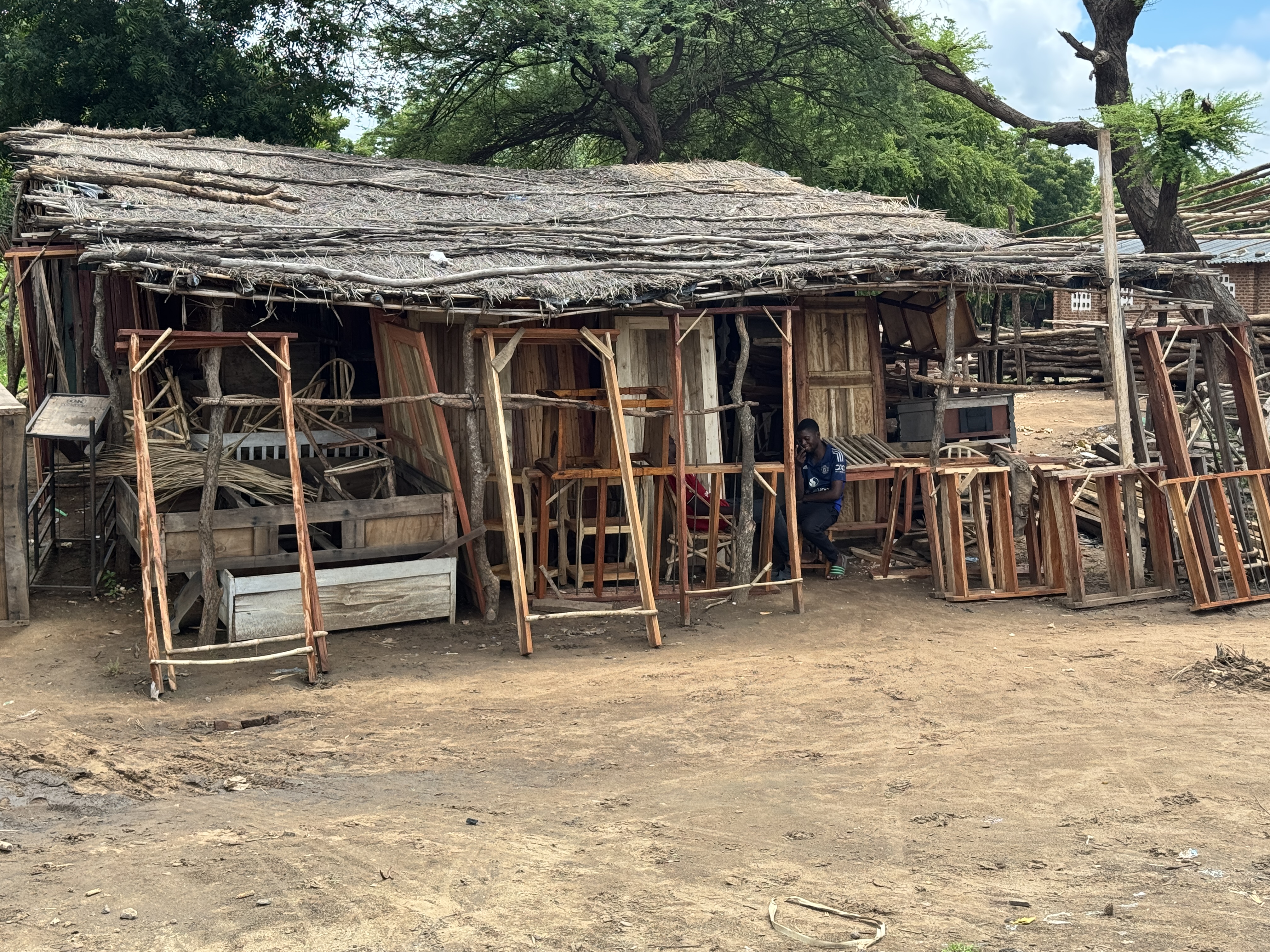 There are also lots of small craft shops, here making door and window frames.