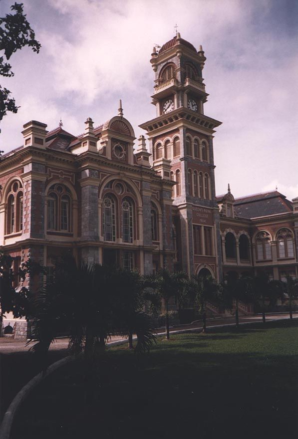The Queen's Royal College, fronting the city-center Queen's Park Savannah. Its best known graduate may be V.S. Naipaul, who wrote of it, pai
