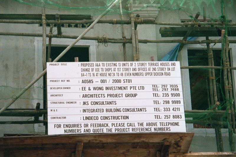 A sign goes up, with information about residential conversion to shops and offices.