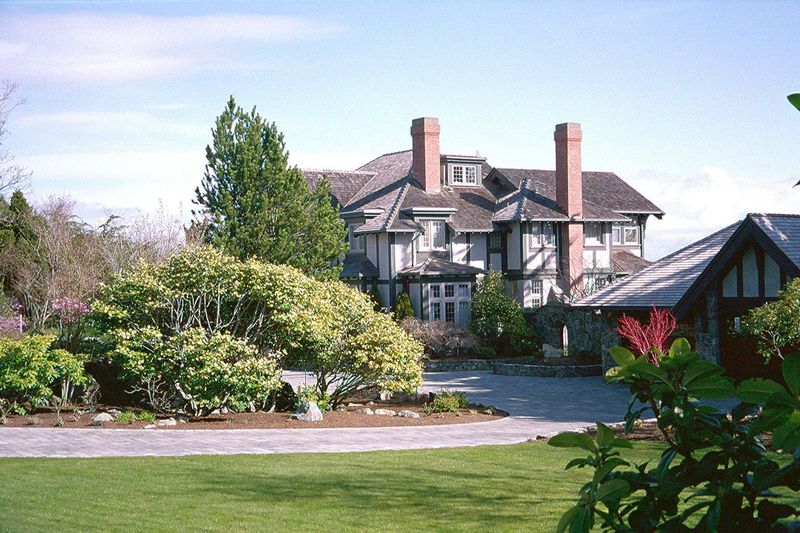 Updated with lighter colors, this bungalow spreads out on the waterfront and looks east to the Cascades of Washington. "Not half bad," you'r