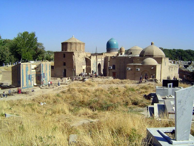 Emerging from the trees at the upper left, we've circled behind the buildings and climbed a low hill. Qutham's mosque can be seen on the rig
