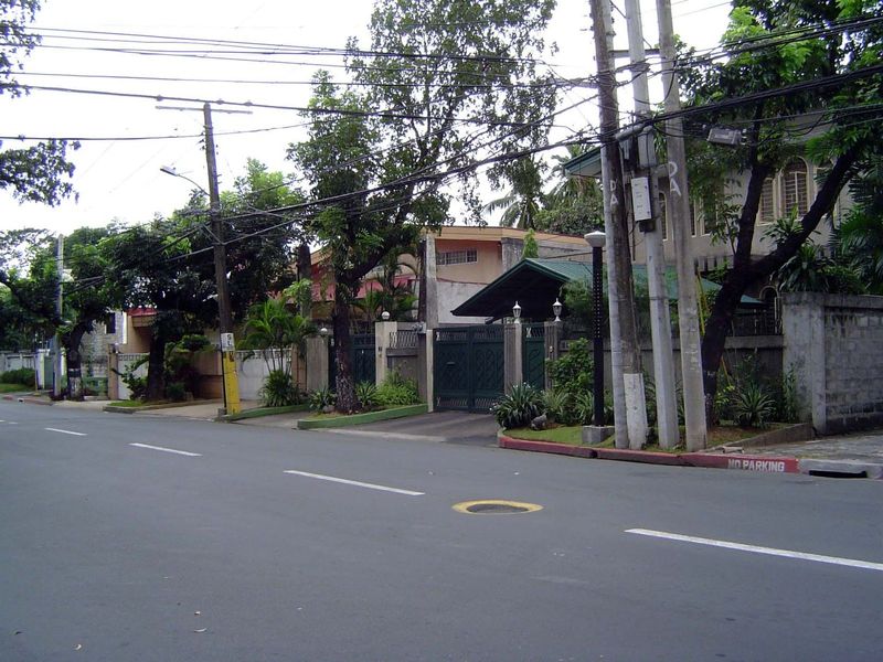 Flanking the center is a gated community. Manila has many. This one is San Lorenzo Village, a relatively modest refuge from the central city