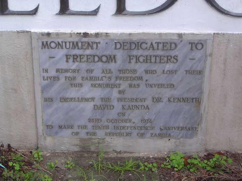 The plaque below the statue makes no mention of Mutembo.