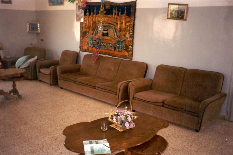 Upstairs, there's a modern, flat-roofed addition with this "best room" and an image of Mecca.
