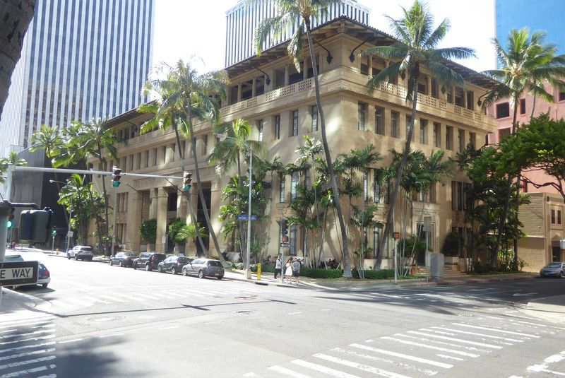 The handsomest building in town is near the foot of Bishop Street. The twin towers of the Amfac or Topa Center rise in the background, but i