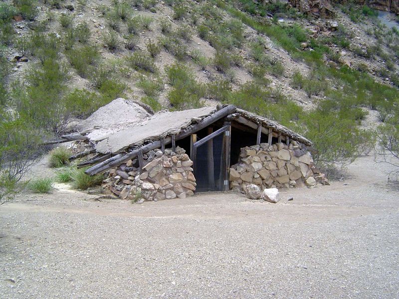 An abandoned house, half-buried for insulation.