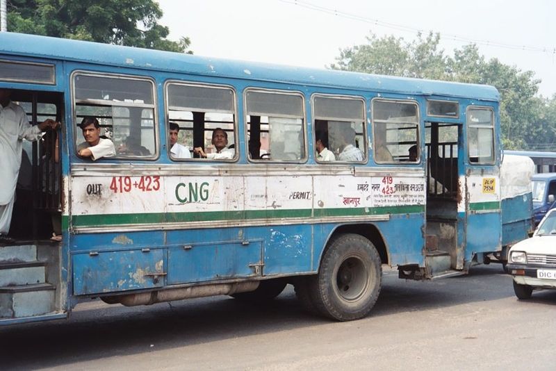 On the east side of the Jami Masjid, there's heavy traffic. As the "CNG" indicates, however, this bus, like all the others in Delhi's fleet,