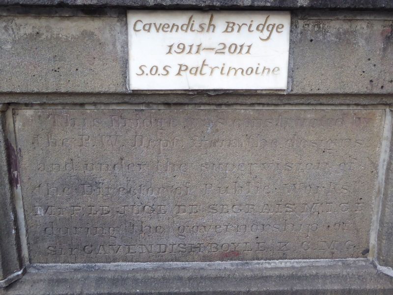 Hard to read? "This bridge was constructed by the P.W. Dept. from the designs and under the supervision of the Director of Public Works, Mr.