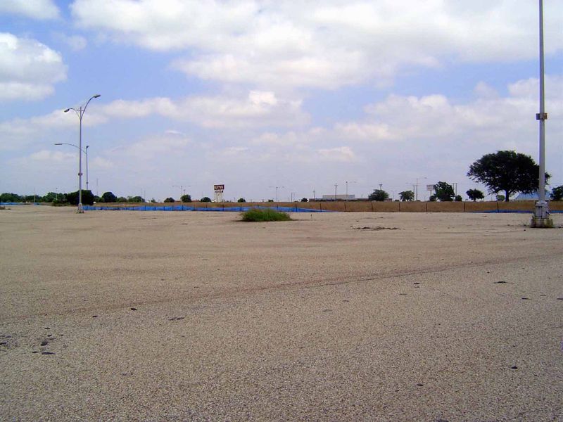 In the distance you can see the pole sign in the last picture. The parking lots are intact, but weeds cover what was once Montgomery Ward, W