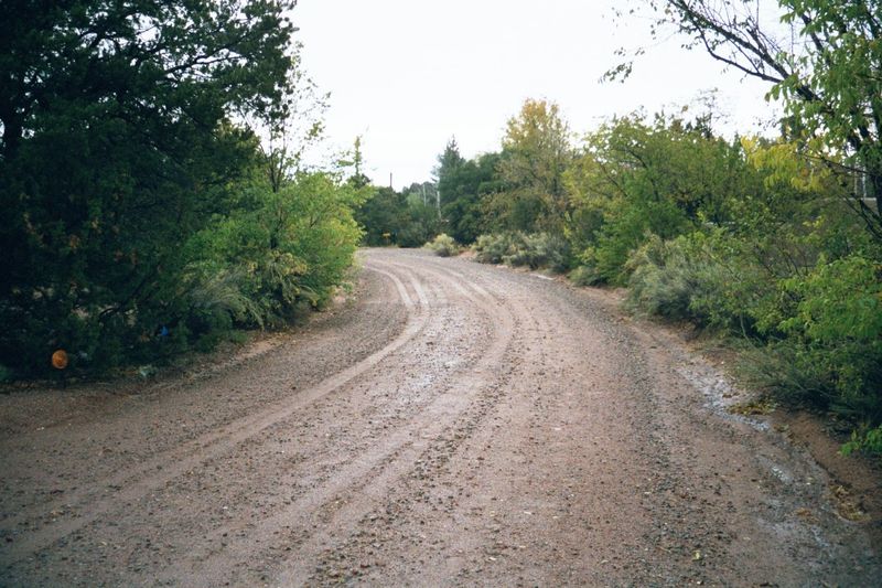 Camino Ranchitos. Think you're way out of town? Wrong: you're less than a mile from the town plaza, which lies more or less straight ahead. 