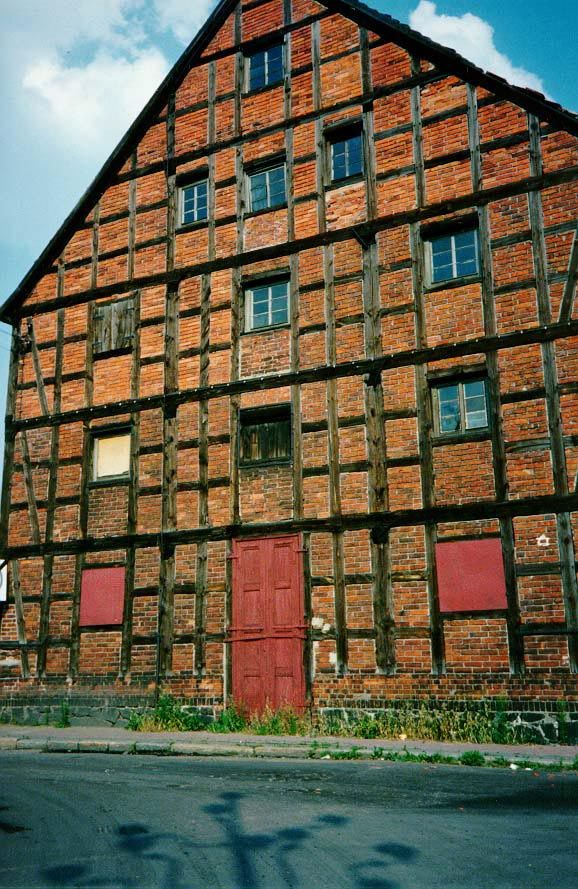 A splendid example of brick-filled timber framing. It's in Bydgoszcz and unlikely to go away soon.