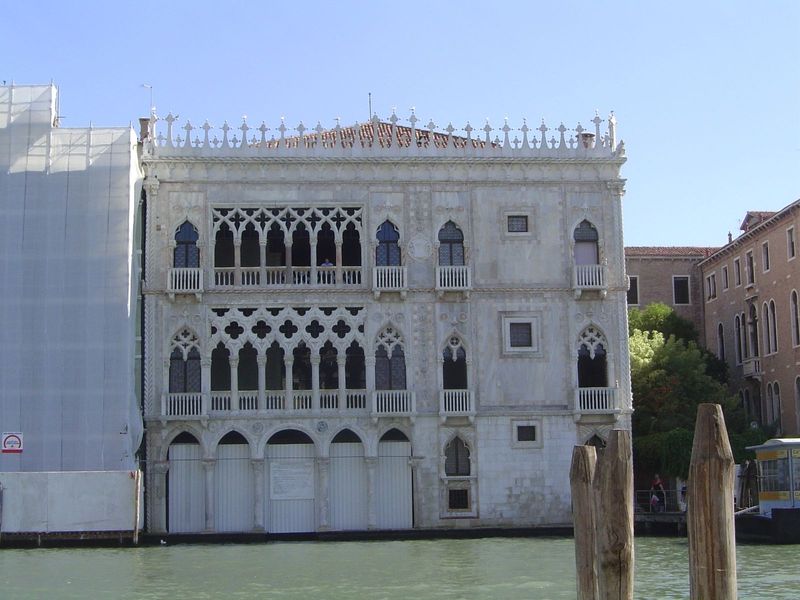 A more orthogonal view of the building with triple-stacked arcade, quatrefoil roundels, and alternating marble and limestone.