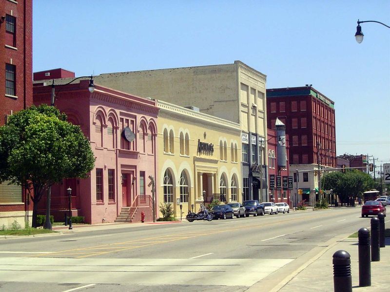 Aha! Now you get it. Restoration in pastels spells festive retail. Call it Bricktown, one of the city's most successful urban renewal undert