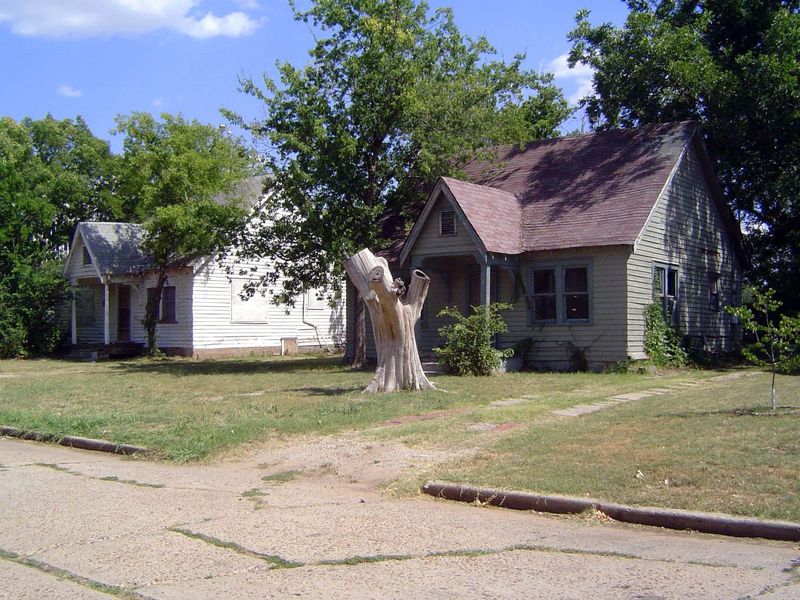 At the end of the same block: two owner-occupied homes built—surely by the same hand—in 1932. We're at 316 and 320 NE 26th, and if we had X-