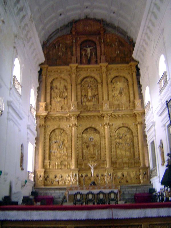The high altar shows events from the life of St Catherine of Alexandria. The central image on the lower level shows Catherine holding a book