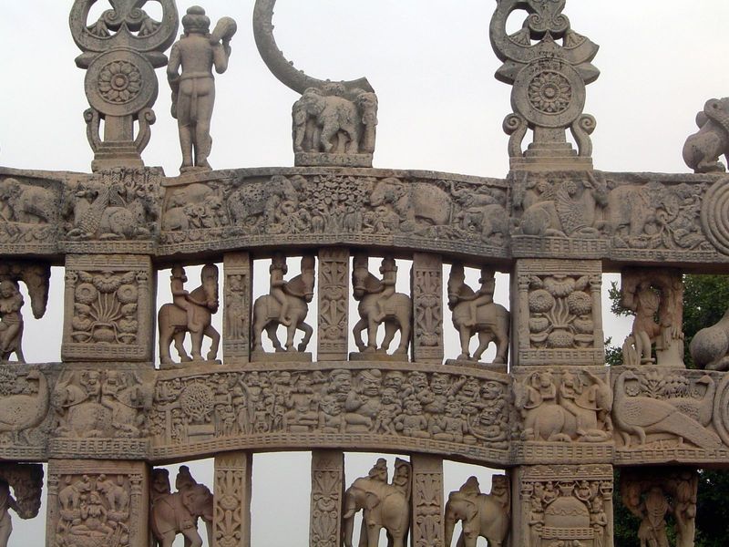 The upper architrave illustrates the Chhaddanta jataka, a story about a bodhisattva born as a 6-tusked elephant who, from pity, allows a hun