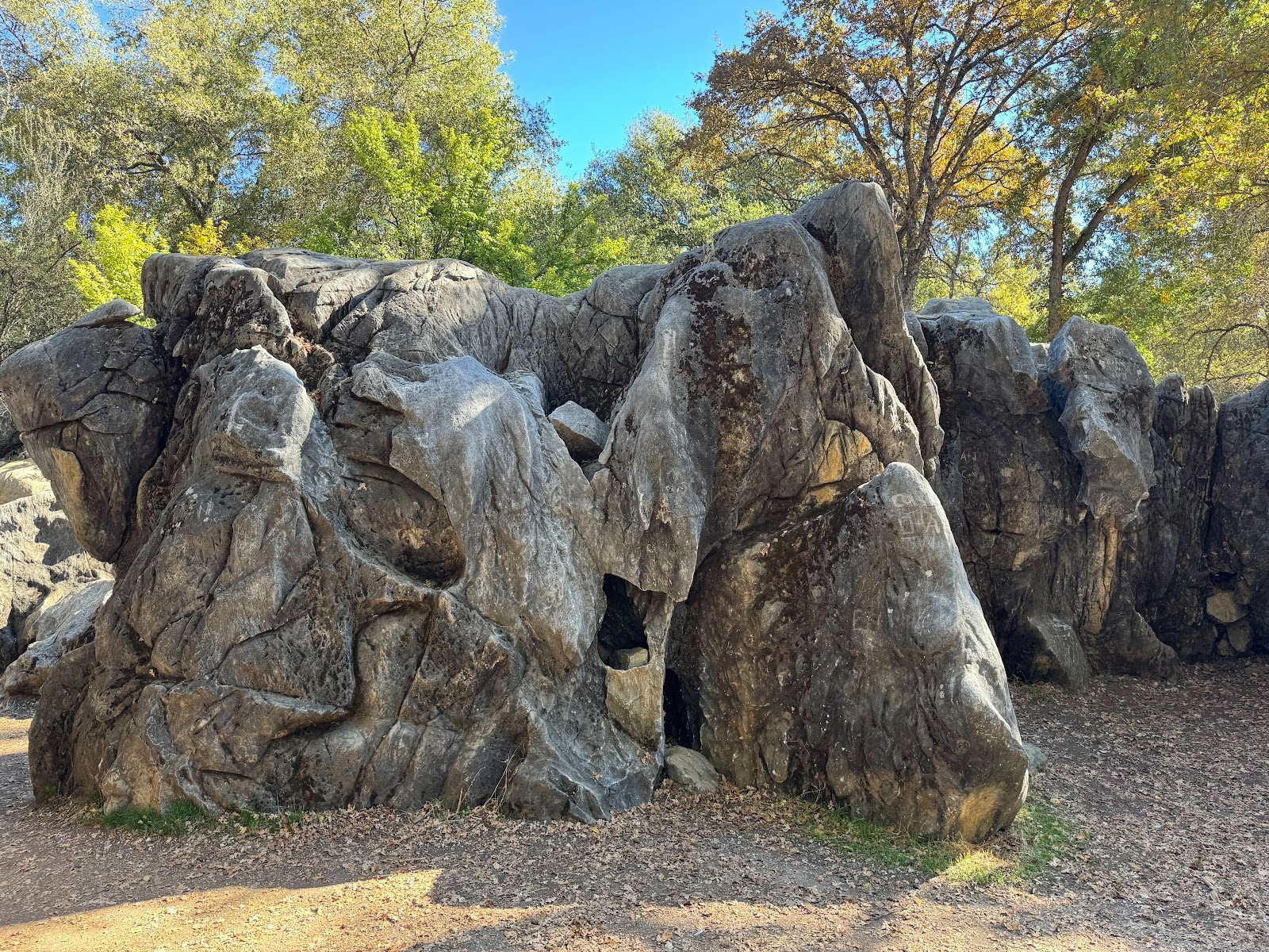 Think you're in Guilin?  It's limestone, and I suppose you could call it karst.  Reminds me of pictures in the Babar books by Jean de Brunho
