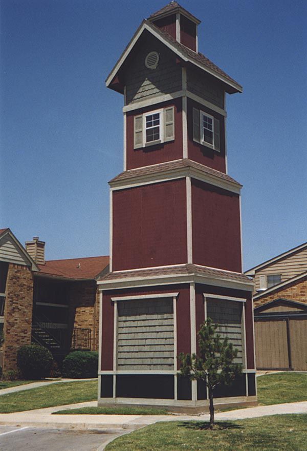 Up the road a couple of miles, another clock tower at another apartment complex. There's no clock, but Rapunzel leans out the window Mondays