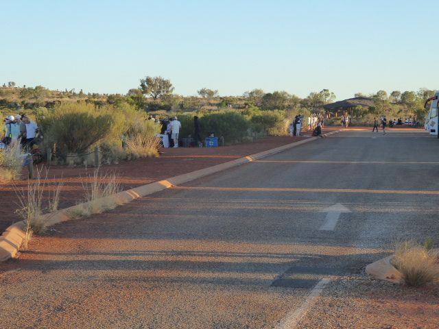 Each evening a dozen buses stop to let visitors watch sunset at the rock.
