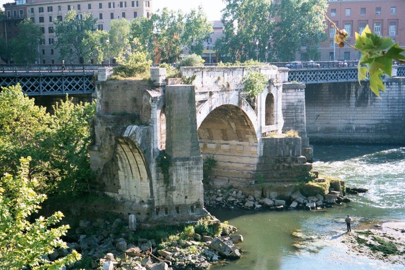 Downstream a mile but only a thousand feet west of the forum is the one remaining arch of the Pons Aemilius, built in 181 B.C. and the first