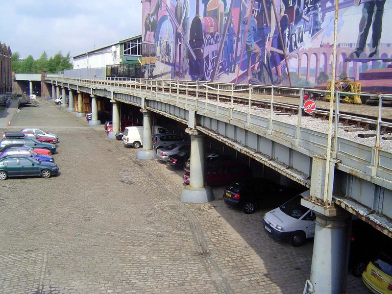 Herculean cast-iron pillars support the tracks approaching the station.