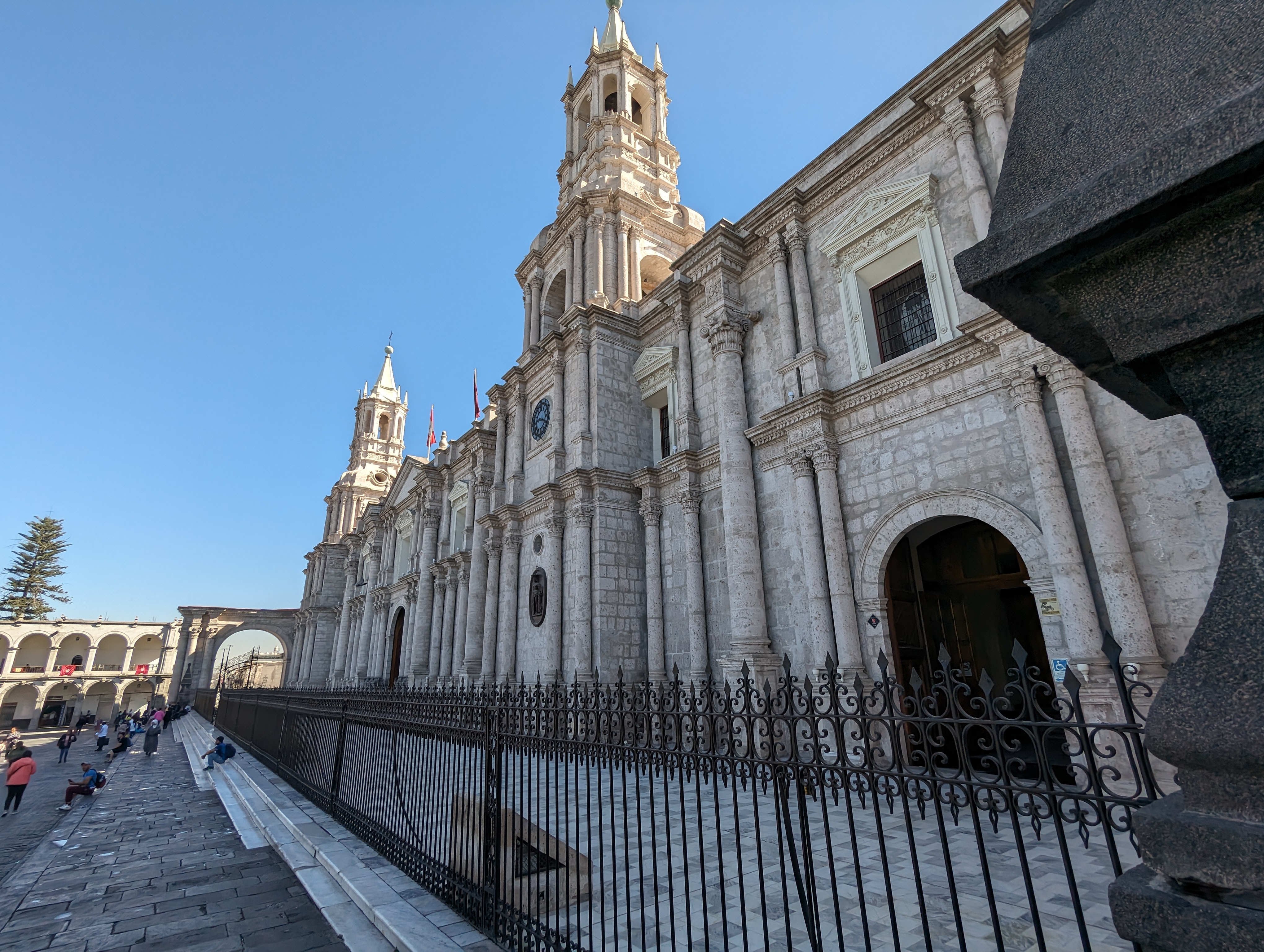 The city's cathedral fronts on the plaza, but it's a 19th century building.  Thank an earthquake in 1868.  See the arch in the distance?
