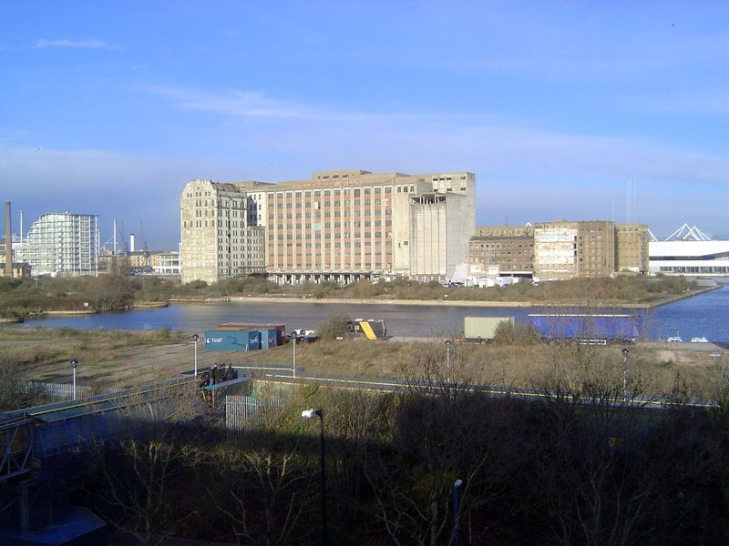 The view north toward the Millennium Mills. The water here is an L-shaped branch of the Royal Victoria Dock.