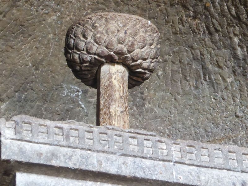 An umbrella once rose from the relic box; only the base remains. Original? Hard to say.