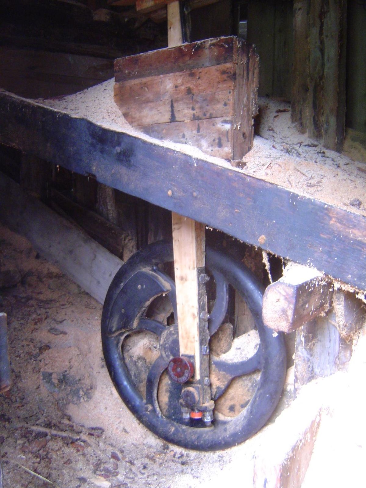 Inside one of the mills, a water wheel sets this wheel spinning to create vertical motion.
